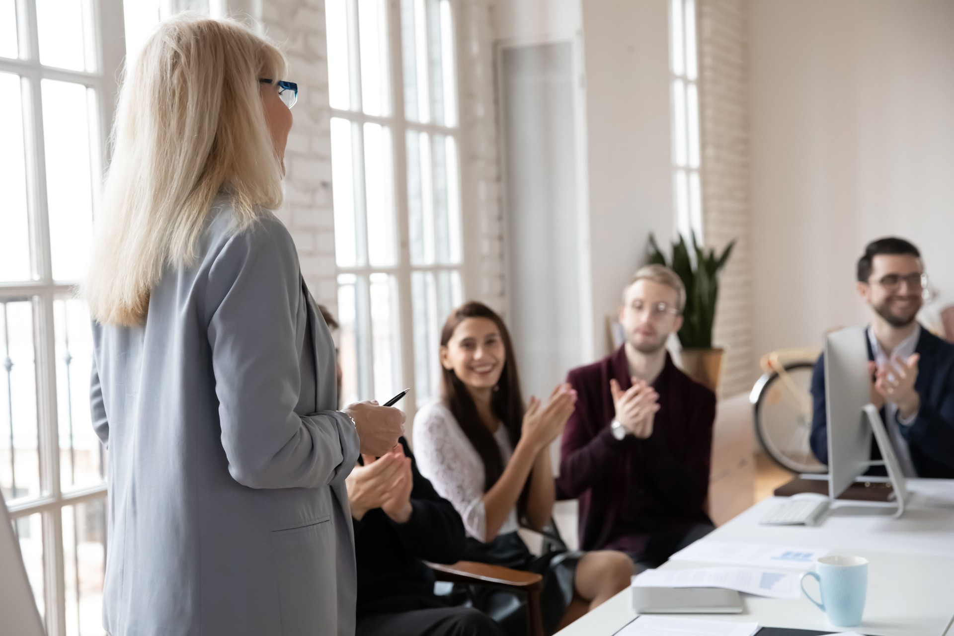 Team adjusting roles and responsibilities during a collaborative restructuring session in a small business setting
